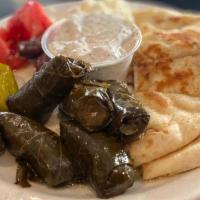 Grape Leaves Dinner · The entrée are served with pita bread and a side Greek salad, and 6 grape leaves.