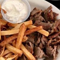 Gyro Dinner · This dish is served with pita bread, side Greek salad, fries and a side of tzatziki and a po...