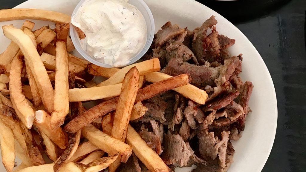 Gyro Dinner · This dish is served with pita bread, side Greek salad, fries and a side of tzatziki and a portion of rotisserie sliced gyro.