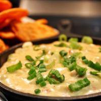 Spicy Crab Dip · Spicy. Lump crab, roasted red pepper, pepper jack, cream cheese, cajun spices, scallions and...