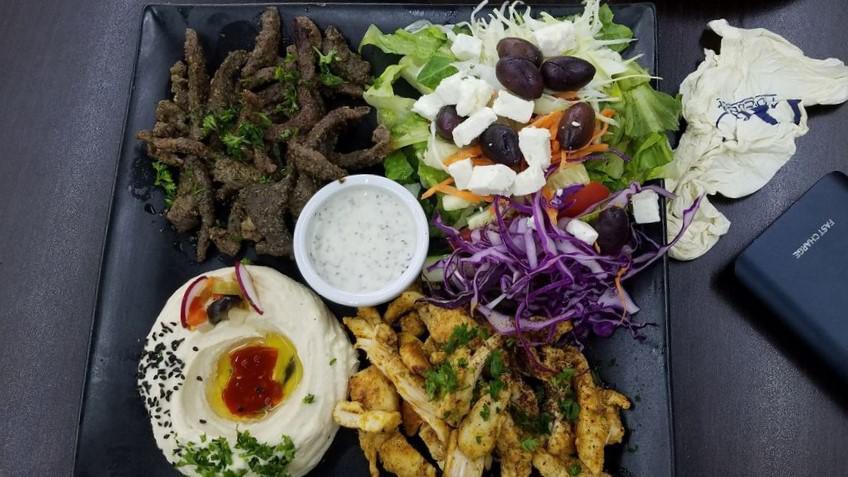 Gyro Platter Bundle · Spiced lamb and beef with dressing. Served with two choice side. Served with your choice of 20 oz Coca-Cola product.
