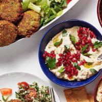Vegetarian Platter · Vegetarian. Humus, baba ganoush, tabbouleh, falafel, and veggie grape leaves. Served with pi...