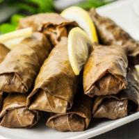 Veggie Grape Leaves Platter · Vegetarian. Stuffed with rice, dill, parsley, seasoning, and onion. Served with hummus and s...