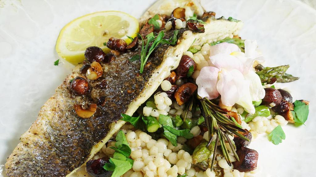 Branzino Fillet With Couscous  · Fresh Branzino Fillet, Lime Greek Herbs, Kalamata Olives, Couscous. Served with two sides of your choice of hummus+pita bread or salad or rice.
