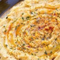 Hummus Appetizer · Specialty of creamy blended chickpeas, olive oil, tahini, and lemon juice.