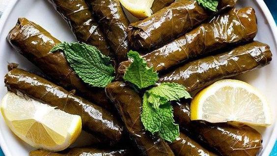 Meat Grape Leaves · Grape leaves stuffed with rice and herbs.