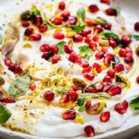 Labneh · Thick strained Greek yogurt prepared with garlic and olive oil.