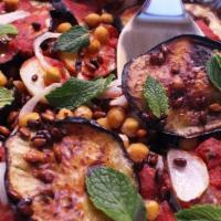 Vegetarian Moussaka · Roasted eggplant, garlic, fresh herbs and tomatoes. Served with pita bread.