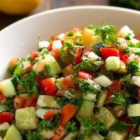 Egyptian Salad · Chopped tomatoes, cucumbers, lemon juice, salt, pepper, green onions, and parsley.