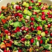 Tabbouleh Salad · Finely chopped fresh parsley, green onions, tomatoes, and bulgar wheat with a lemon, and oli...
