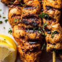 Chicken Kebab · two skewer of Tender chunks of chicken breast marinated with a blend of seasonings and charb...