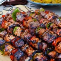 Combo Beef, Chicken, And Lamb Kebab · three skewer of Charbroiled tender lamb cubes, beef cubes, chicken cubes marinated with spec...