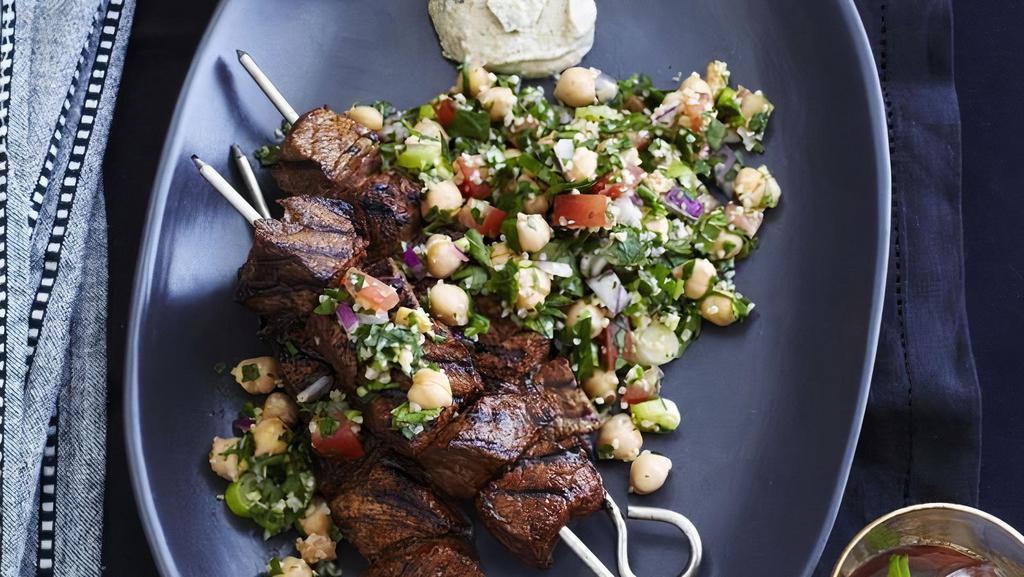 Beef Shish Kebab · two skewer of Charbroiled tender beef sirloin cubes marinated with a special spices. Served with two sides of your choice of hummus+pita bread or salad or rice