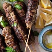 Beef Kofta · two skewer of Charbroiled ground beef sirloin seasoned with fresh onions with special spices...