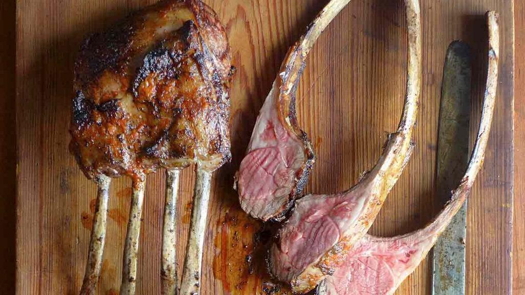 Rack Of Lamb Platter · Four pieces. Fresh lamb chops marinated with olive oil, herbs, and spices.  Served with two sides of your choice of hummus+pita bread or salad or rice