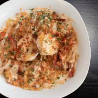 Brie'S Shrimp N Grits · Creamy stone ground grits topped with jumbo shrimp and beef sausage in a creole sauce with c...