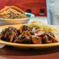 Large Oxtails · Entrees are served with choice of rice and fried plantains. (without substitution)