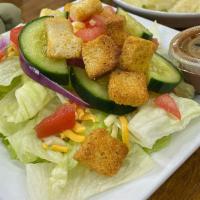 House Salad · Red onion, cucumber, cheese, tomato and croutons on iceberg lettuce.