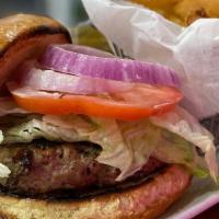 Turkey Burger · Juicy turkey burger, lettuce, red onion, tomato and garlic aioli on bun.