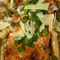 Rasta Pasta · Penne pasta tossed in a housemade creamy jerk sauce with onions and peppers. Served with a g...