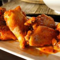 Wings, Bone In · Six juicy fried and sauced wings with your choice of sauce.