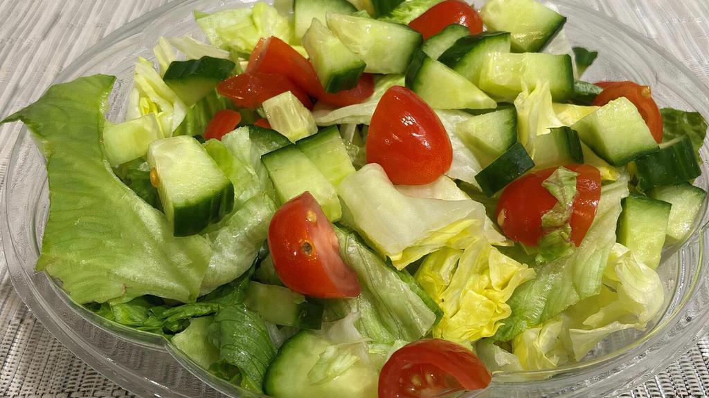 Small Garden Salad · Chopped iceberg lettuce, diced cucumbers and grape tomatoes.  Served with your choice of dressing.
