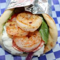 Shrimp Pita · Grilled shrimp with romaine, tomatoes, red onions and tzatziki.