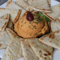 Hummus · Our freshly-made hummus is served with toasted pita wedges. Hummus flavors change weekly.