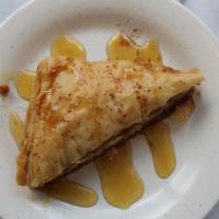 Homemade Baklava · Layers of buttery phyllo dough filled with a sweet walnut mixture, topped with honey syrup.