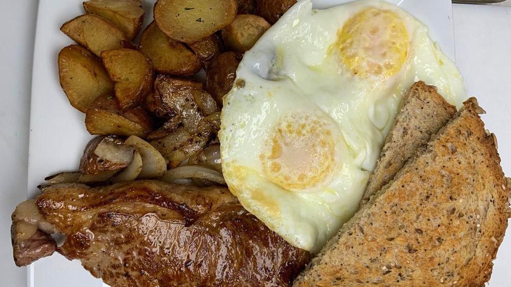 Steak & Eggs · 2 eggs any-style, breakfast potatoes & toast.