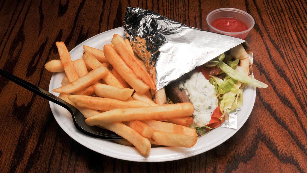 Shawarma Combo · You pick the meat, we cook it with shawarma spices and top it with lettuce, tom and tahini sauce. Served with Fries and Drink.