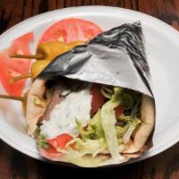 Phoenix · Marinated and grilled chicken breast in hot pita with lettuce, tom and tzatziki.