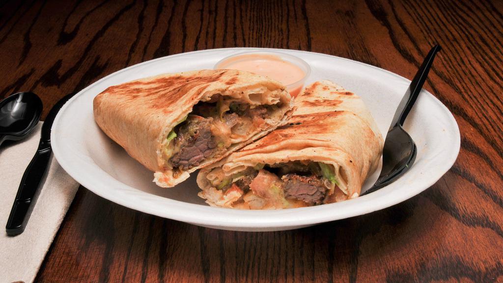 Spicy T Wrap · Gyro meat,rice, tabouli, grilled veggies grilled to perfection. Served with our famous spicy T- sauce.