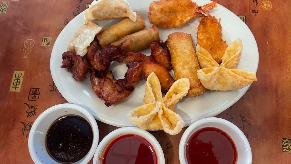 Pao Pao Platter · Starter dish: 2 Crab Rangoons, 2 Spring Rolls, 2 Chicken on Stick, 2 Dumplings, and 2 Fried Shrimp.