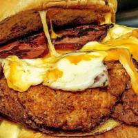 Still Clucked Up* · Golden, double battered fried chicken breast with thick-cut turkey bacon, a fried egg, cover...