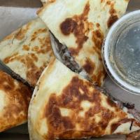 French Dip Quesadilla · Flour tortilla, braised beef, mozzarella, Swiss, au jus.
Served with fries, salad or chips.