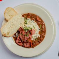 Red Beans & Rice · This Louisiana Favorite Combines Slow Cooked Red Beans & Grilled Smoked Sausage. Served Over...