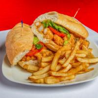 Gulf Shrimp Po-Boy · Fried Shrimp With Lettuce, Tomato, & Remoulade Sauce, Served With French Fries.