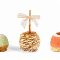 Spring Apples (Your Choice) · caramel-covered Granny smith apple dipped in white confection, and rolled in your choice 
Le...