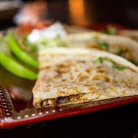Quesadilla Rellena  · A large, flour tortilla grilled and stuffed with cheese and your choice of chicken or beef. ...