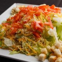 Garden Salad · Fresh iceberg lettuce, tomatoes, onions, and shredded cheese. Topped with croutons and your ...