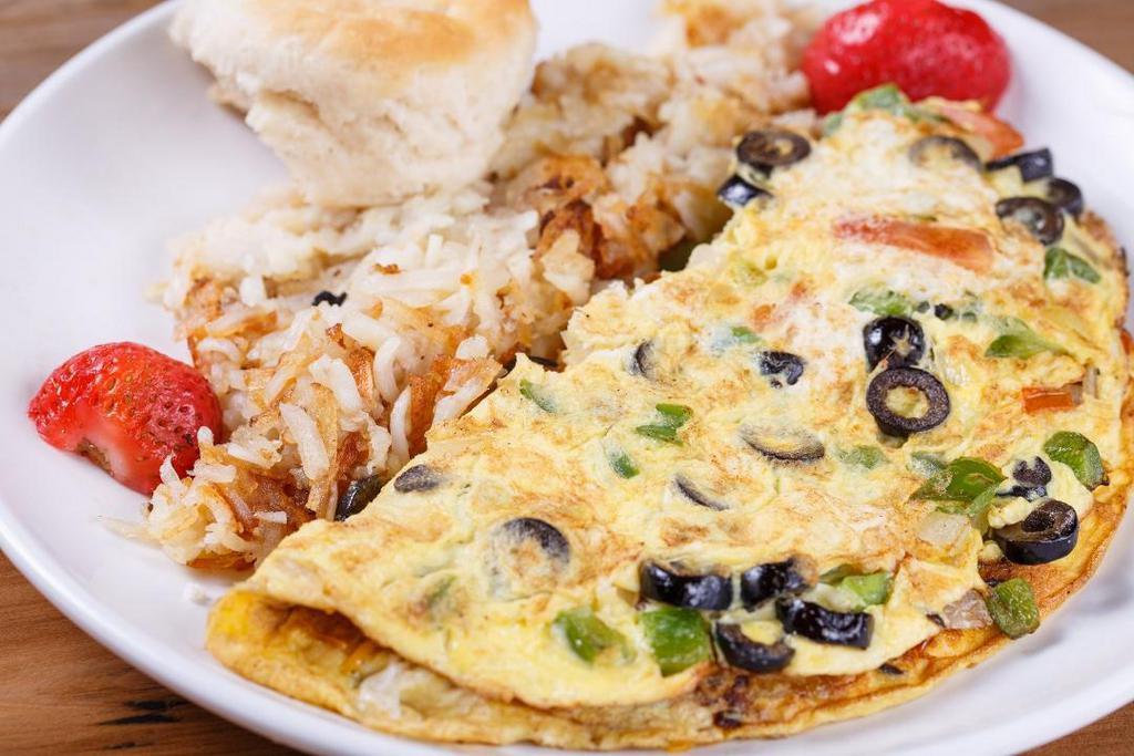 Veggie Omelet · With cheese, tomato, mushrooms, green pepper, onion & black olives. . (Comes w/ a bread and side)