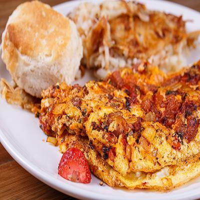 Alligator Omelet · With alligator sausage, cheese, tomato, onion, parsley, paprika & cracked pepper.. (Comes w/ a bread and side)
