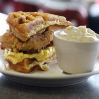 Mae'S Breakfast Sandwich · Fried chicken breast, bacon, a scrambled egg with a waffle bun, served w/ a side of country ...
