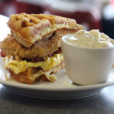 Mae'S Breakfast Sandwich · Fried chicken breast, bacon, a scrambled egg with a waffle bun, served w/ a side of country gravy
