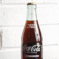 Mexican Coke · Mexican Coke is made with cane sugar. It comes in glass bottles, which might help it to main...