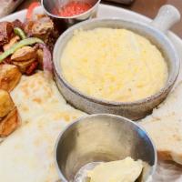 Farmer’S Breakfast · Two eggs, choice of home fries or grits, choice of bacon or sausage, toast.