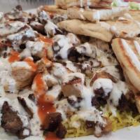 Mixed Over Rice · Seasoned Chicken & Lamb, Basmati Rice, Lettuce, Tomatoes, Pita Bread