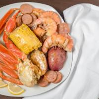 Cajun Sampler · Gluten-free, spicy. Five spicy steamed gulf shrimp, one ear of corn, four sausage pieces, tw...