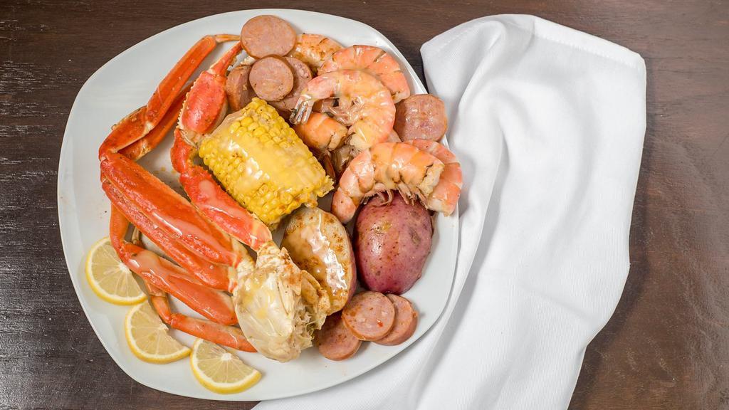 Cajun Sampler · Gluten-free, spicy. Five spicy steamed gulf shrimp, one ear of corn, four sausage pieces, two potato pieces.